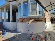 Ведутся работы по утеплению цоколя фасадным пенопластом