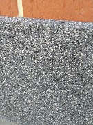 Мы завершили фасадные работы. Здесь было выполнено утепление и отделка цоколя мраморной крошкой