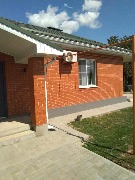 Мы завершили фасадные работы. Здесь было выполнено утепление и отделка цоколя мраморной крошкой